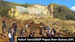 Папуа–Жаңы Гвинеянын Ямбали кыштагы.