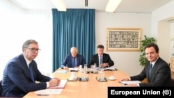 Serbian President Aleksandar Vucic (left to right), EU envoys Josep Borrell and Miroslav Lajcak, and Kosovar Prime Minister Albin Kurti meet in Brussels on September 14.