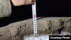 Villages were carpeted in drifts of gray ash as deep as 8.5 centimeters. 