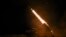 Ukrainian troops fire a BM-21 Grad multiple-launch rocket system toward Russian troops on the front line in the Donetsk region.