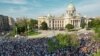 People attend a protest by Serbia's opposition parties in reaction to two mass shootings in the same week, in Belgrade on June 3.
