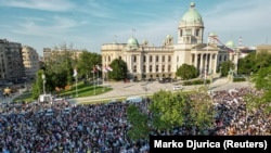 People attend a protest by Serbia's opposition parties in reaction to two mass shootings in the same week, in Belgrade on June 3.