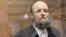 Vitaly Koltsov appears in court in Moscow on June 14.