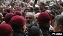 Armenia - Archbishop Bagrat Galstanian jostles with riot police, May 31, 2024.