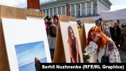 People in Kyiv pay their respects to Iryna Tsybukh, who was killed in the Kharkiv area on May 29 while serving as a volunteer medic.