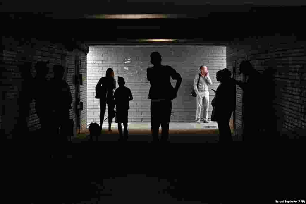 People take shelter in an underground crossing during an attack on Kyiv on June 1. Subway stations and underpasses such as this are in some cases the only underground spaces guaranteed to be open during air-raid alerts.&nbsp;