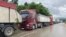 Trucks wait at the Merdare border crossing between Kosovo and Serbia on June 15 amid tightened border controls. 