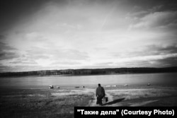 Father Mikhail travels by boat to the neighboring village of Nazimovo, where he will serve the faithful.