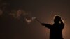 IRAN-WOMEN/PROTEST --An Iranian woman lights a firework during the Wednesday Fire celebration (Chaharshanbeh Suri in Persian) at a park in Tehran, Iran March 14, 2023.