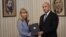 Bulgarian President Rumen Radev (right) hands a mandate to form a government to Goritsa Grancharova-Kozhareva in Sofia on August 9.