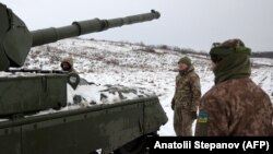 Ukrainian soldiers near the front line in the Kharkiv region 