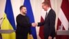 Ukrainian President Volodymyr Zelenskiy (left) meets his Latvian counterpart, Edgars Rinkevichs. in Riga on January 11. 