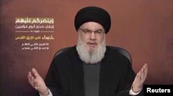 تصویری از سخنرانی ویدئویی حسن نصرالله از مکانی نامشخص در لبنان