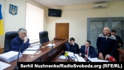 Mazepa (right) is accused of establishing a criminal group that illegally privatized 2.4 hectares of land located 12 kilometers outside Kyiv on a scenic stretch of the Dnieper River.
