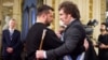 Ukrainian President Volodymyr Zelenskiy (right) greets Javier Milei on the day of his inauguration as president of Argentina in Buenos Aires on December 10. 