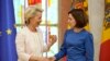 Moldovan President Maia Sandu (right) welcomes European Commission President Ursula von der Leyen during a media conference in Chisinau prior to the start of the European Political Community Summit on May 31.
