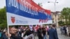 Members of the Russian Night Wolves motorcycle gang carry a flag at the March of the Immortal Regiment in Banja Luka on May 9.