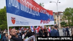 Members of the Russian Night Wolves motorcycle gang carry a flag at the March of the Immortal Regiment in Banja Luka on May 9.