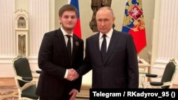 Президент России Владимир Путин и сын главы Чечни Ахмат Кадыров