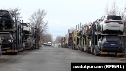 Armenia - Car carrier trailers line up near a customs terminal outside Gyumri, March 13, 2023