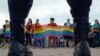 People wave rainbow flags during a gay-pride rally in St. Petersburg in 2017.