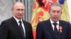 Russia's President Vladimir Putin (left) awarded an Order of Alexander Nevsky to Ravil Maganov at a ceremony in 2019.