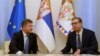 Miroslav Lajcak (left), the EU envoy for dialogue between Kosovo and Serbia, and Serbian President Aleksandar Vucic (right) met in Belgrade with a visiting U.S. special envoy on August 25.