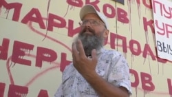 Russian Man Who Scrawls Names Of Bombed Ukrainian Cities On His Store Could Face Prison