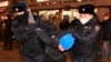 Police detain a demonstrator during a protest against Russia's invasion of Ukraine in Moscow on February 24.