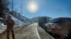 Nagorno Karabakh - A Russian peacekeeper stands guard on a blocked road leading to Armenia, December 12, 2022.