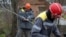 Workers repair broken power lines damaged by shelling in Ukraine's Donetsk region on November 25. 