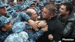 Armenian police detain opposition protesters in Yerevan on May 3. 
