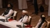 Members of the Taliban delegation attend the opening session of the peace talks between the Afghan government and the Taliban in the Qatari capital, Doha, on September 12.