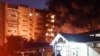 An apartment building catches fire after a Sukhoi Su-34 aircraft crashed into it on October 17.