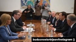 Serbian President Aleksandar Vucic (center left) speaks with U.S. senators Thom Tillis (first right), Chris Murphy (second right), and Jeanne Shaheen (third right) in Belgrade in April 19. 