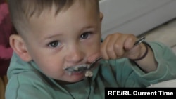 The displaced families at the Martsenyuk home say they are living like one big family, looking after one another's children and celebrating holidays and birthdays together.