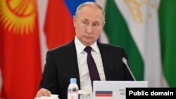 Russian President Vladimir Putin attends a CIS meeting in Astana on October 14.