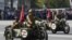 RUSSIA - Participants wearing historical uniforms ride in WWII-era motorcycles adorned with stickers of the letter Z during a military parade in Novosibirsk, 9MAY2022