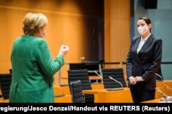 Ангела Мэркель і Сьвятлана Ціханоўская