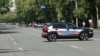 Armenia - Police cars parked on Yerevan's Marshal Bagramian Avenue blocked by relatives of missing soldiers, June 19, 2025. 