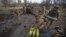 Ukrainian soldiers prepare cannon shells before firing them toward Russian positions in Donetsk region on January 1.