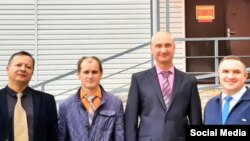  Sergei Yuferov, Mikhail Burkov, Vladimir Bukin, and Valery Slashchev near the Tyndinsky District Court of the Amur region in September.