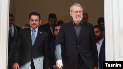 علی لاریجانی، دبیر شورای عالی امنیت ملی ایران (سمت راست) در دیدار با همتای عراقی خود