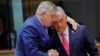 Slovak Prime Minister Robert Fico (left) speaks with his Hungarian counterpart, Viktor Orban, at an EU summit in Brussels earlier this year. 