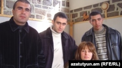 Armenia - Former soldiers Musa Serobian (L) Arayik Zalian (C) and Razmik Sargsian pose for a photograph with their laywer Zaruhi Postanjian two months after their unexpected release from jail, Yerevan, 28Feb2007.