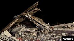 A photo released by Russian authorities shows the ruins of a house destroyed in a reported drone attack in Belgorod on October 12. 