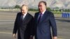 Tajik President Emomali Rahmon (right) greets his Russian counterpart, Vladimir Putin, in Dushanbe on June 28. 