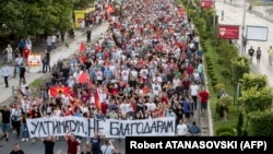 Thousands of people march at a rally in Skopje on July 6 protesting against the compromise proposal aimed at ending the dispute with Bulgaria and opening negotiations for EU membership.