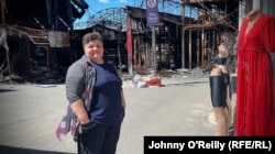 Lyudmyla Kireyeva waits for customers outside her bikini shop.