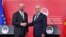 European Council President Charles Michel (left) shakes hands with Macedonian Prime Minister Dimitar Kovachevski at a joint press conference in Skopje on July 5.